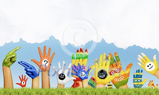 Human hands in colorful paint showing symbols Human hands in colorful paint showing symbols