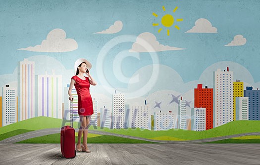 Young woman in red dress with red luggage talking on mobile phone Young woman in red dress with red luggage talking on mobile phone