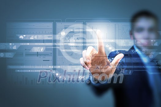 Businessman pushing with finger icon on virtual screen Businessman pushing with finger icon on virtual screen