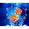 Conceptual image with dice cubes in clear blue water