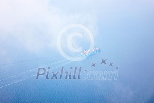 aerial view of the sea with a passing cargo ship