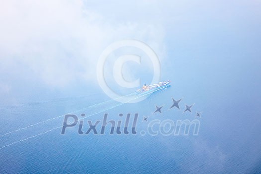 aerial view of the sea with a passing cargo ship aerial view of the sea with a passing cargo ship