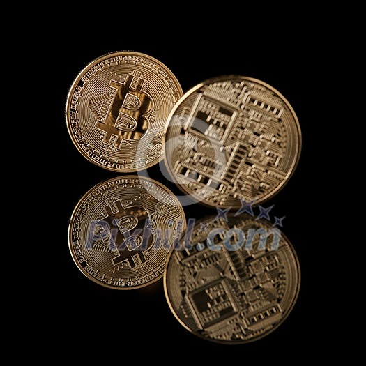 Bitcoin gold coins from face and back isolated on black background. Conceptual image for crypto currency market