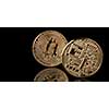 Bitcoin gold coin from both sides isolated on black background, New Virtual money concept, can be used for video cover or site