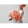 happy smiling girl holding a large bouquet of pink roses. valentine's day, mother's day