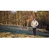 Portrait of a senior man relaxing during a walk outdoors, on a sunny winter day