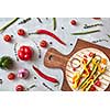 Sliced raw vegetables on a tortilla on a wooden board. The next stage of cooking burito. Step-by-step recipe. Top view, flat lay.