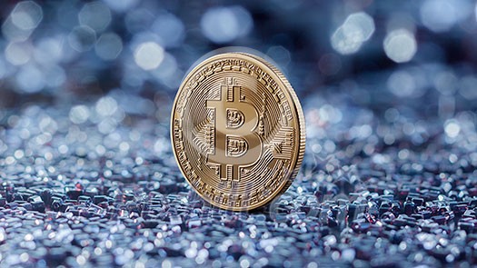 Gold coin bitcoin on a blue blurred background. Cryptocurrency and blockchain trading concept. Growth of the crypto currency, can be used for video or site cover Gold coin bitcoin on a blue blurred background. Cryptocurrency and blockchain trading concept. Growth of the crypto currency, can be used for video or site cover