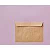 Brown envelopes cardboard sheet of recycle paper gift cards and invitations or business concept with copy space isolated on pink background. Flat lay