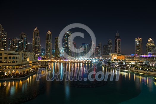 DUBAI UAE 31 JANUARY 2017 famous musical fountain in Dubai with skyscrapers in the background on a beautiful summer evening DUBAI UAE 31 JANUARY 2017 famous musical fountain in Dubai with skyscrapers in the background on a beautiful summer evening