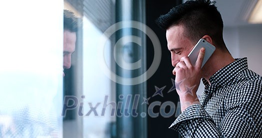 laughing man talking on the phone in office interior laughing man talking on the phone in office interior