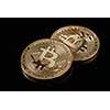 Gold bitcoin coin stacked against a dark background as a symbol of electronic currency. . Bitcoin cryptocurrency. Electronic money mining concept