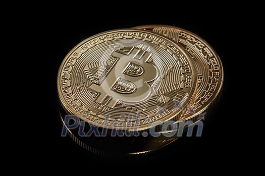 Stacked bitcoin BTC cryptocurrency. BTC golden coins as symbol of electronic virtual money for web banking and international network payment on a black background