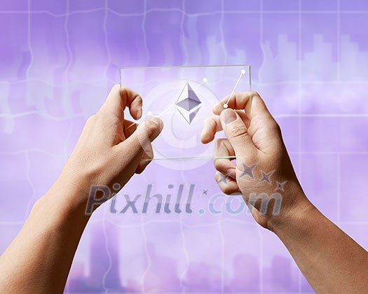 A glass screen with the Icons of ethereum and a crypto currency graph in the hands of a man on the ultraviolet background of the city. Business, finance and technology concept.