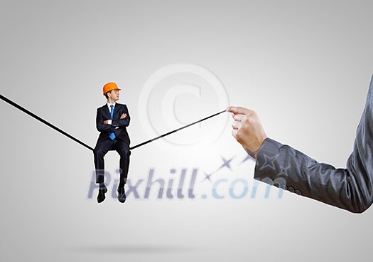 Handsome man engineer sitting on drawn line Handsome man engineer sitting on drawn line