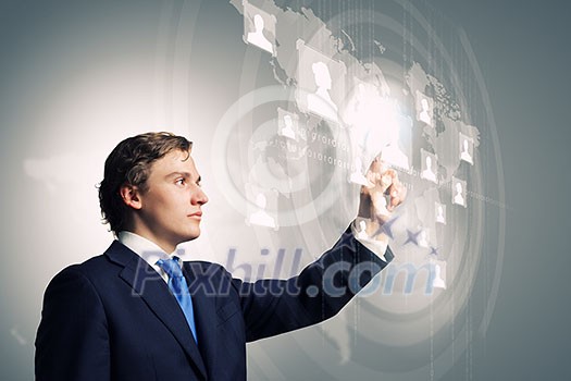 Businessman in suit touching icon of media screen Businessman in suit touching icon of media screen