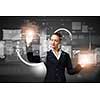 Attractive businesswoman touching icon of media screen