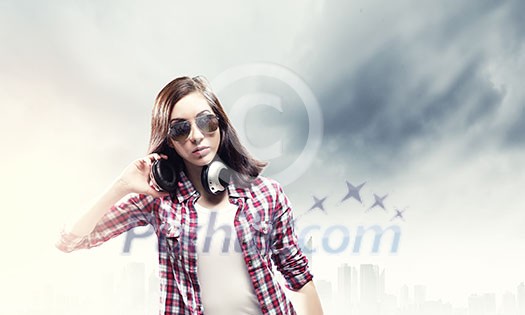 Young pretty girl in casual wearing headphones Young pretty girl in casual wearing headphones