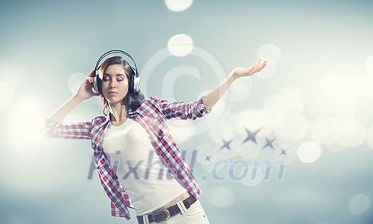 Young pretty girl in casual wearing headphones Young pretty girl in casual wearing headphones