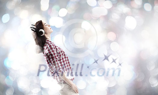 Young pretty girl in casual wearing headphones Young pretty girl in casual wearing headphones