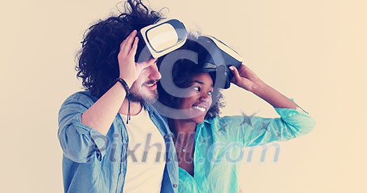 Happy multiethnic couple getting experience using VR headset glasses of virtual reality, isolated on white background