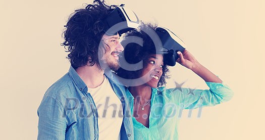Happy multiethnic couple getting experience using VR headset glasses of virtual reality, isolated on white background Happy multiethnic couple getting experience using VR headset glasses of virtual reality, isolated on white background