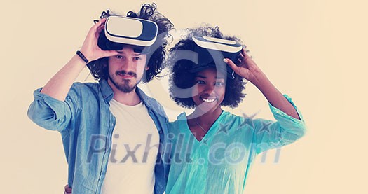 Happy multiethnic couple getting experience using VR headset glasses of virtual reality, isolated on white background Happy multiethnic couple getting experience using VR headset glasses of virtual reality, isolated on white background