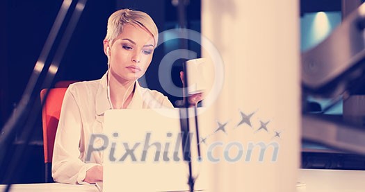 young female entrepreneur working on laptop computer in night office young female entrepreneur working on laptop computer in night office