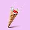Natural refreshing fruit ice cream cone ads with splash milk and strawberrie isolated on pink. Healthy dairy product with fresh and ripe strawberry and milk splashes. Natural strawberry ice cream and summer concept