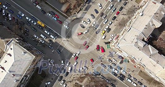 Overhead view of intersection of streets in Kiev with cars, taxis, bus and people from above . High traffic on the streets of the big city of Kiev, Ukraine. Drone video in 4K