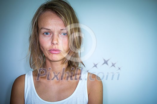 Young woman suffering from a severe depression, anxiety/sudden fear (very harsh lighting is used on this shot to underline/convey the gloomy mood of the scene; color toned image) Young woman suffering from a severe depression, anxiety/sudden fear (very harsh lighting is used on this shot to underline/convey the gloomy mood of the scene; color toned image)