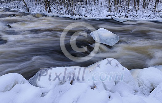 Flowing river in winter