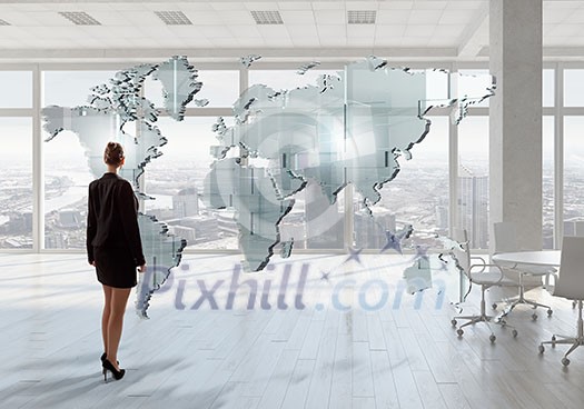 Elegant businesswoman in modern office interior against window panoramic view