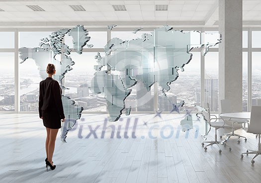 Elegant businesswoman in modern office interior against window panoramic view Elegant businesswoman in modern office interior against window panoramic view