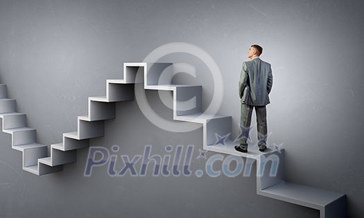Businessman with suitcase standing on stone staircase