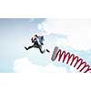 Businessman jumping on springboard as progress concept
