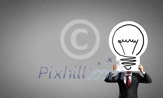 Unrecognizable businessman holding paper sheet with idea concept Unrecognizable businessman holding paper sheet with idea concept