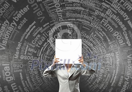 Unrecognizable businesswoman holding paper covering her face Unrecognizable businesswoman holding paper covering her face