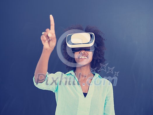 Happy african american girl getting experience using VR headset glasses of virtual reality, isolated on gray background