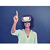Happy african american girl getting experience using VR headset glasses of virtual reality, isolated on gray background