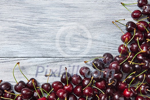 Freshly picked natural organic berries background with copy space. Concept of healthy clean eating.