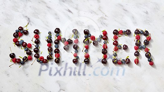 Word SUMMER made ripe sweet juicy red berries on gray stone background. Summer concept of healthy organic rood. Flat lay.