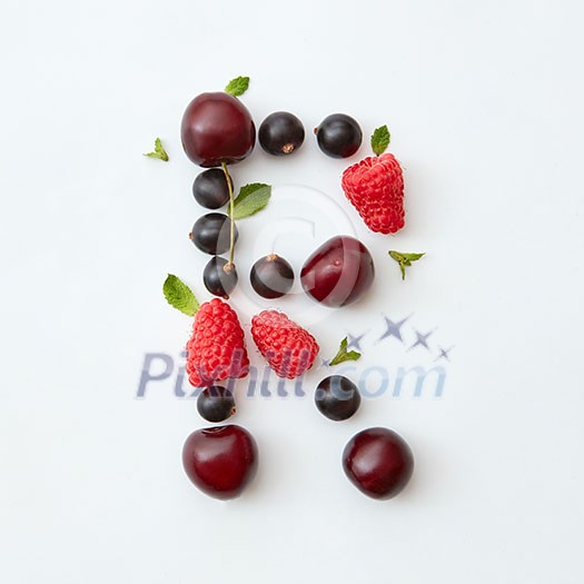Letter R english alphabet in the form of a pattern of natural organic berries - ripe fresh raspberry, black currant, cherry, green mint leaf isolated on a white background. Flat lay