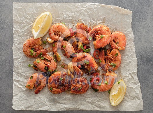 Large grilled BBQ shrimp with sweet chili sauce, green onion and lemon Large grilled BBQ shrimp with sweet chili sauce, green onion and lemon