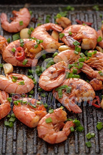 Large grilled BBQ shrimp with sweet chili sauce, green onion and lemon Large grilled BBQ shrimp with sweet chili sauce, green onion and lemon