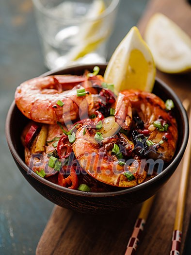 Large grilled BBQ shrimp with sweet chili sauce, green onion and lemon Large grilled BBQ shrimp with sweet chili sauce, green onion and lemon