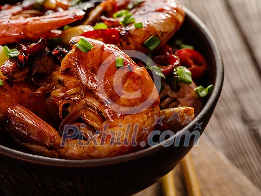 Large grilled BBQ shrimp with sweet chili sauce, green onion and lemon. Close up. Large grilled BBQ shrimp with sweet chili sauce, green onion and lemon. Close up.