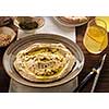 Delicious hummus with pine nuts and olive oil.