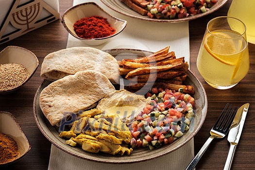 Shwarma in a plate with hummus and salad Shwarma in a plate with hummus and salad