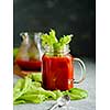 Tomato juice in mason jar with celery and salt